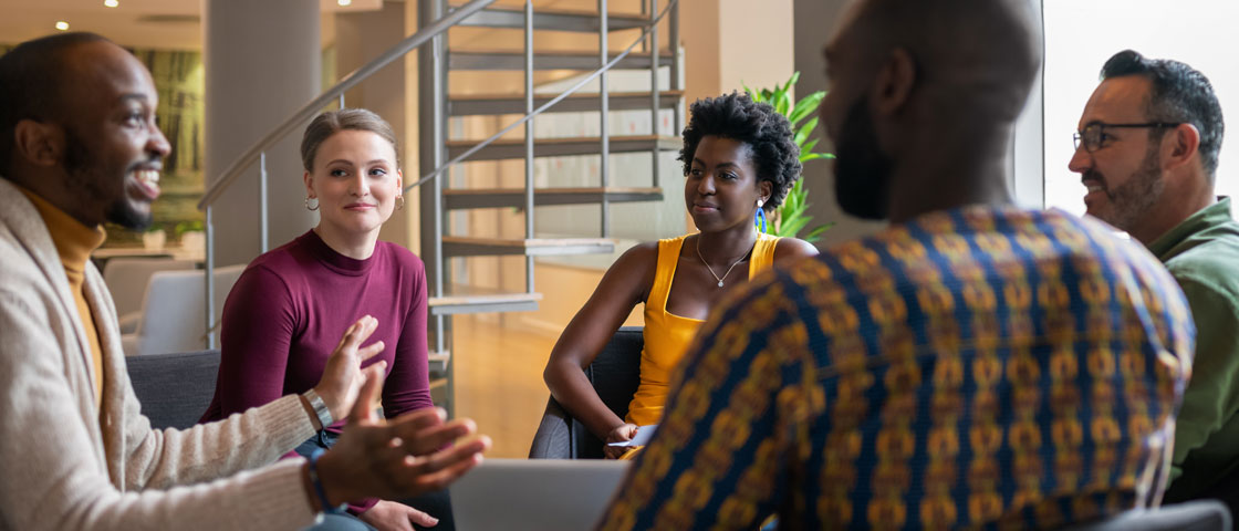 Group of diverse business people having a meeting in a modern work space