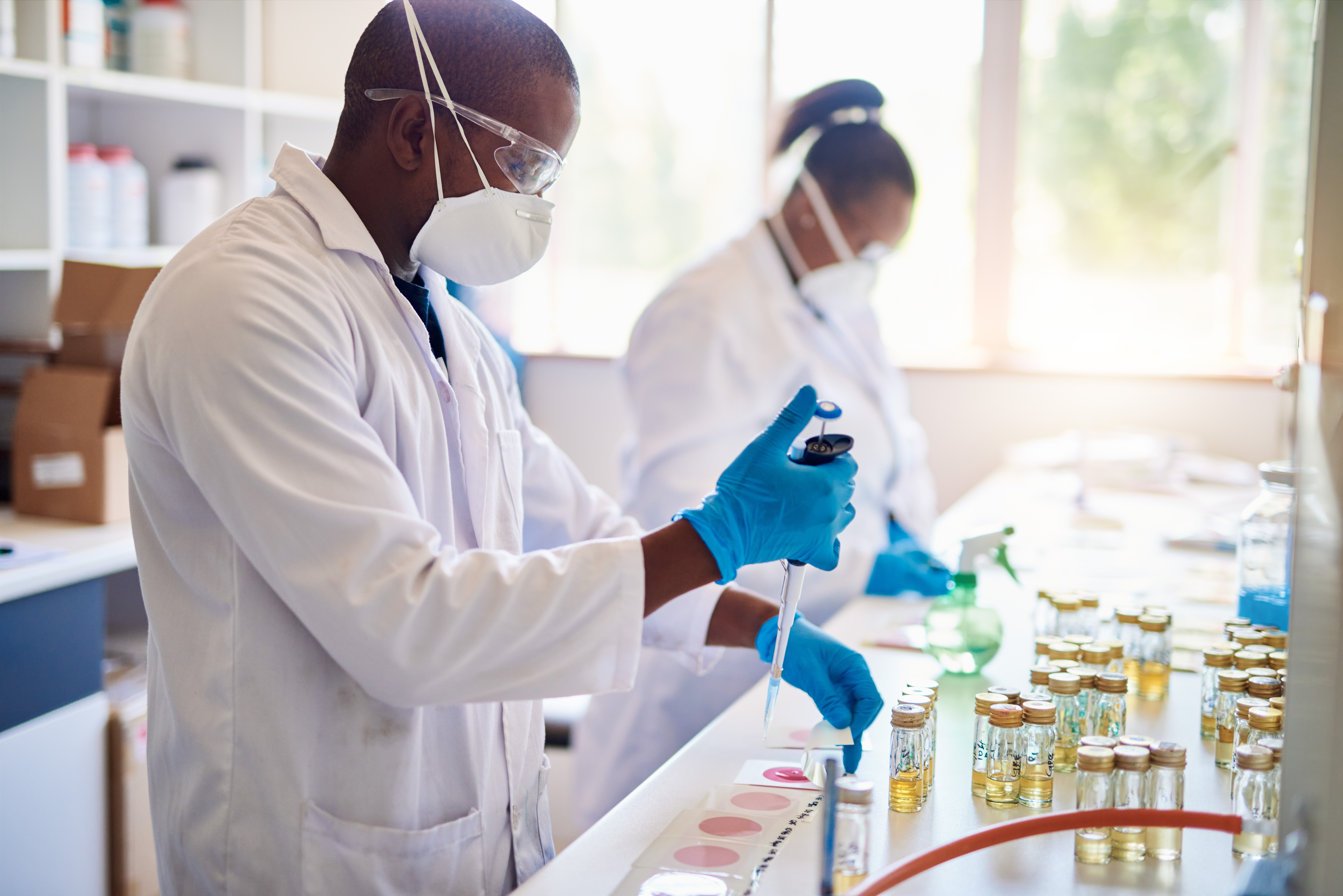 Two African scientists working in a lab