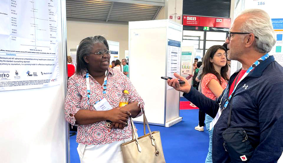 Dorina Onoya presenting at the poster exhibition at AIDS 2024
